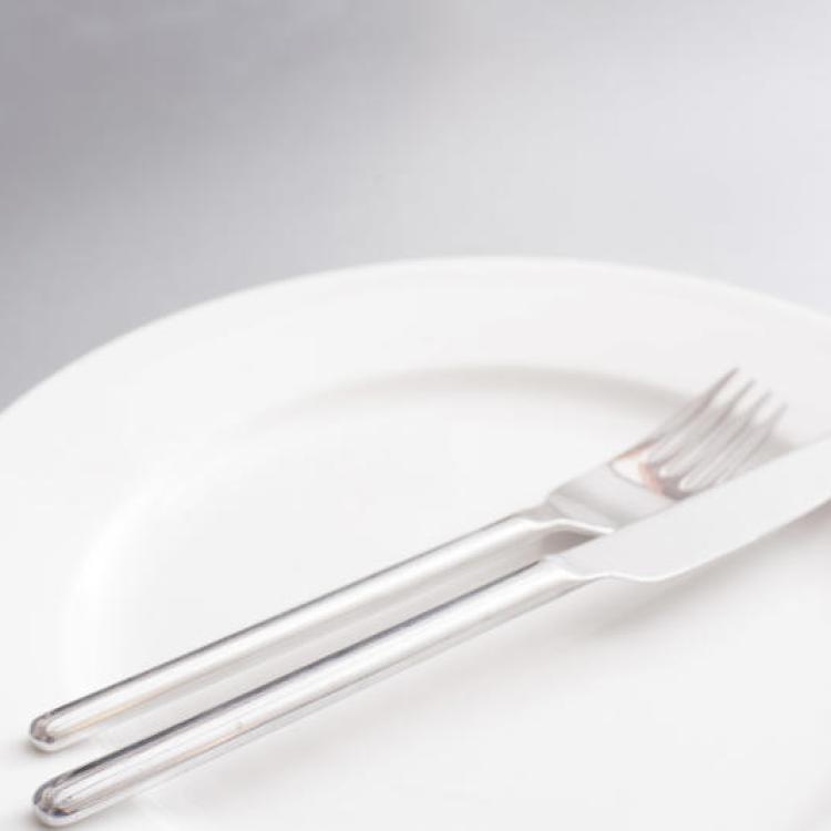 Empty clean generic white plate and cutlery, taken from feefoodphotos